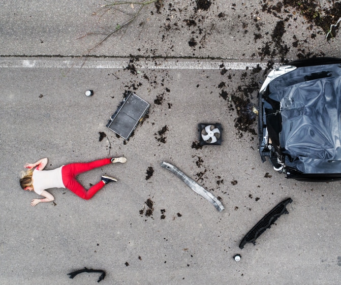 wrongful death claim - dead woman on pavement next to car accident